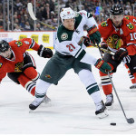 Featured Image: Minnesota's Kyle Brodziak looks to get off a shot as Chicago's Nick Leddy (L) and Patrick Sharp give chase in the Balckhawks' 5-1 win over the Wild on October 28, 2013 in St. Paul, Minn. (Photo: Getty Images / Bruce Kluckhon)