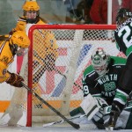 Featured Image: Minnesota's Kate Schipper is denied on one of Lexie Shaw's 32 saves in North Dakota's historic win over Minnesota on Nov. 17, 2013 in Minneapolis. (Photo / Jerry Lee, Gopher Athletics)