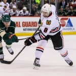 Featured Image: Chicago's Nick Leddy fires away as Minnesota's Charlie Coyle closes in on Thursday, Dec. 5, 2013 in St. Paul, Minn. The Wild defeated the Blackhawks 4-3. (MHM Photo / Jeff Wegge).