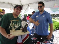Kassian poses with a fan during the MN Wild Road Tour 2012. The fan gifted Matt with a great Gnome/Rooster war statue in honor of a long standing inside joke from Kassian's twitter.