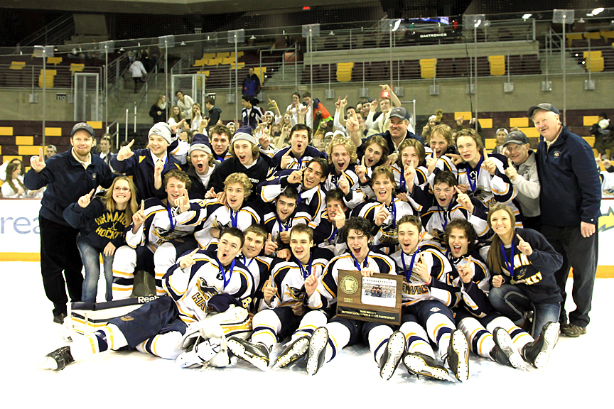 Hermantown team picture with the Section 7A championship trophy.