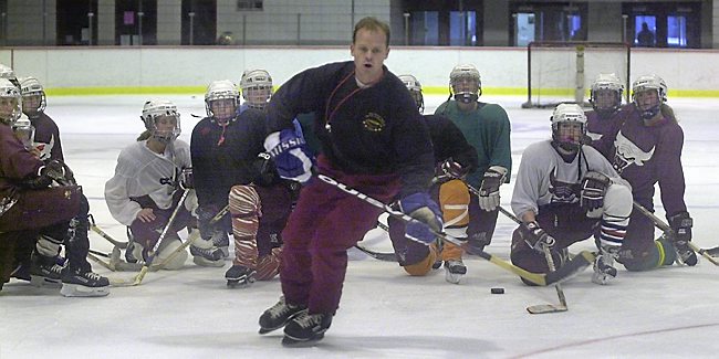 A stickler for fundamentals, South St. Paul girls' hockey coach Dave Palmquist demonstrates some techniques to his team during a 2001 practice at Wakota Arena. (Pioneer Press file photo)