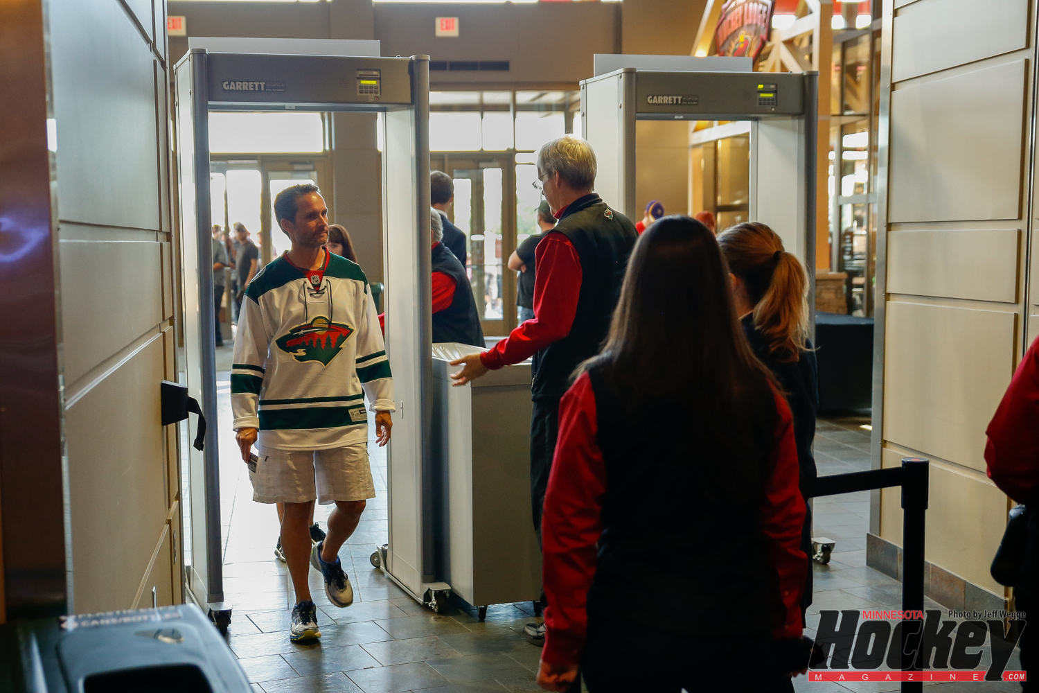 A Wild fan passes through one of the arena's new walk-through metal detectors prior to the team's Sept. 27 preseason game against the Winnipeg Jets. (MHM Photo / Jeff Wegge)